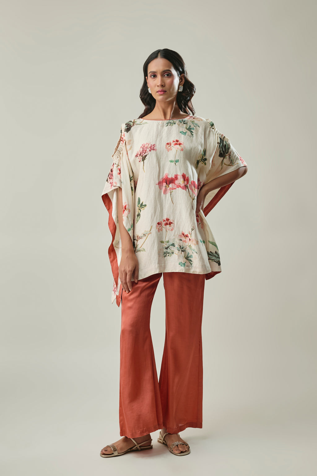 Model wearing ivory & rust satin linen co-ord set