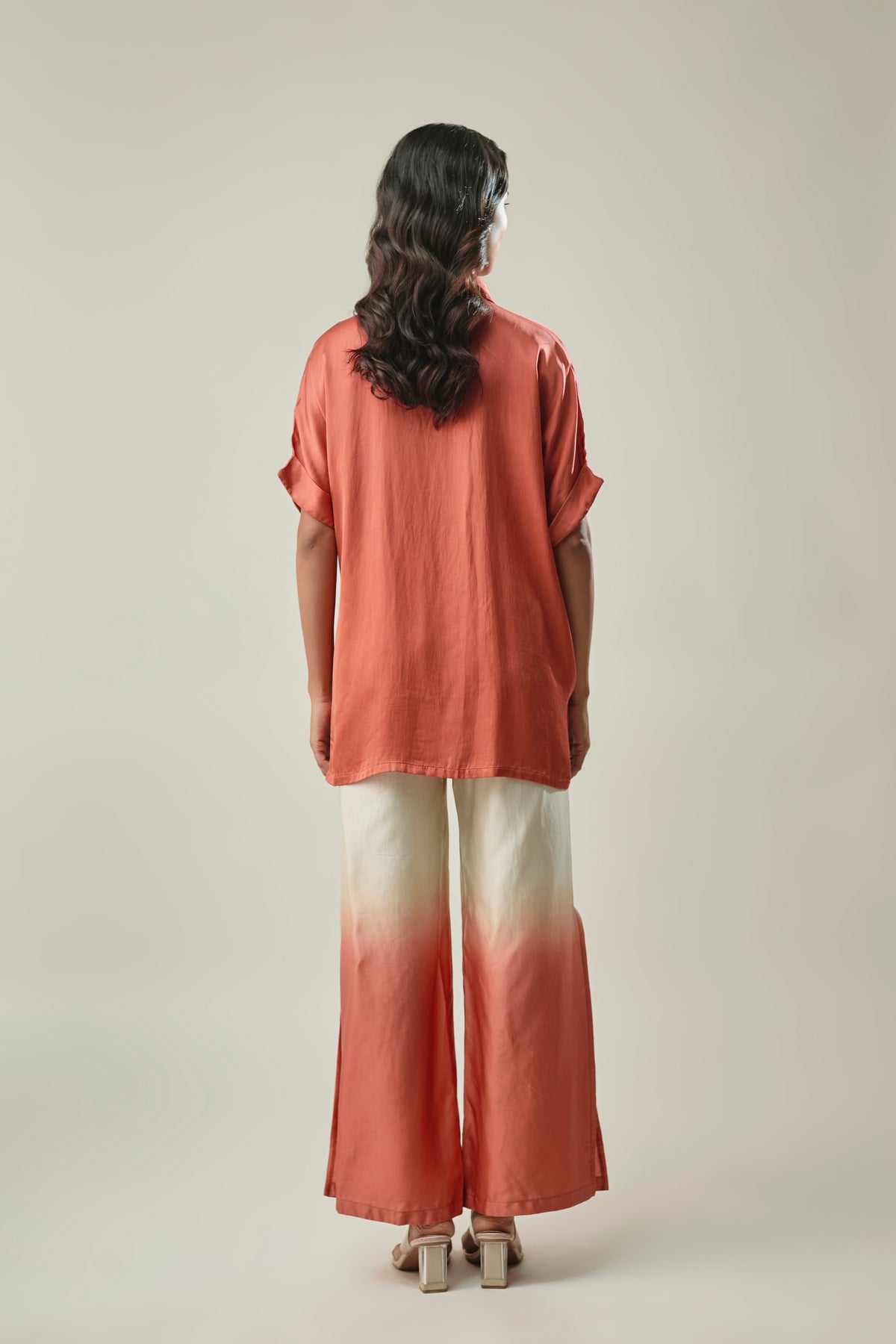 Model wearing rust & ivory satin linen co-ord set