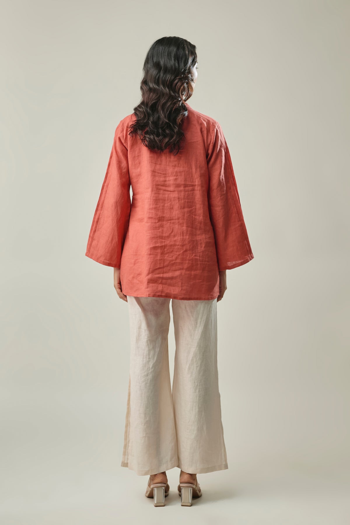 Model wearing rust & ivory pure linen co-ord set