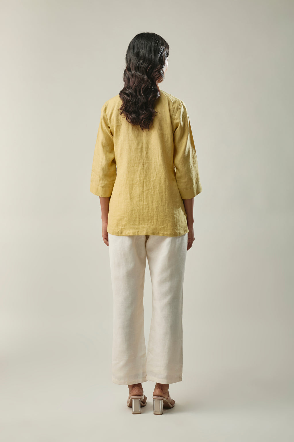 Model wearing light yellow & ivory pure linen co-ord set