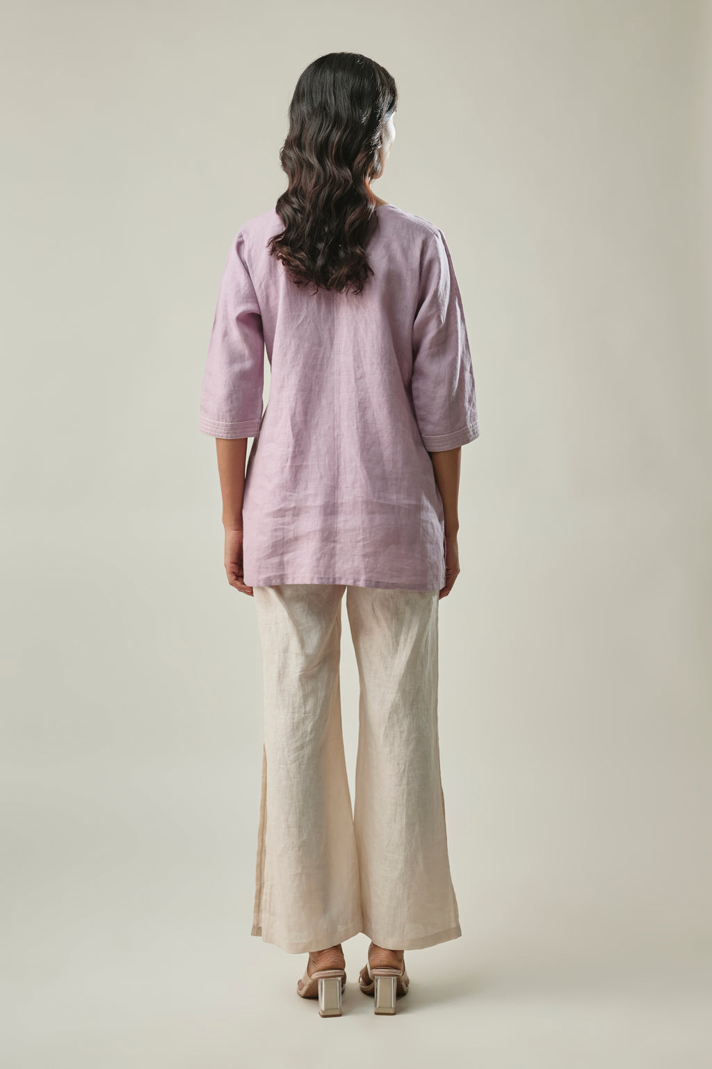 Model wearing lavender & ivory pure linen co-ord set