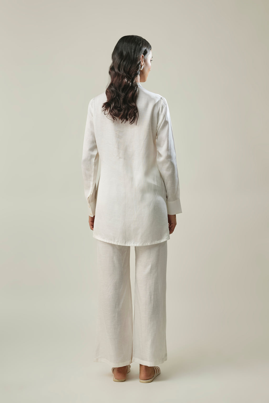 Model wearing off-white satin linen co-ord set