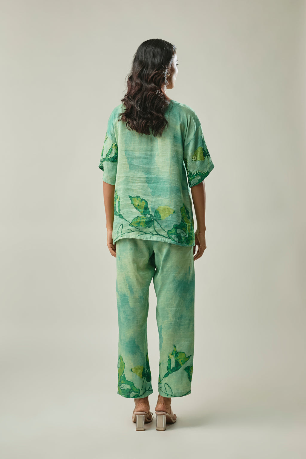 Model wearing green satin linen co-ord set